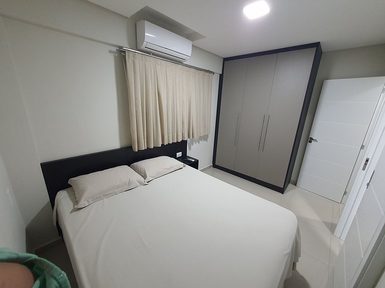 Novo central 2 quartos wifi/garagem/elevador