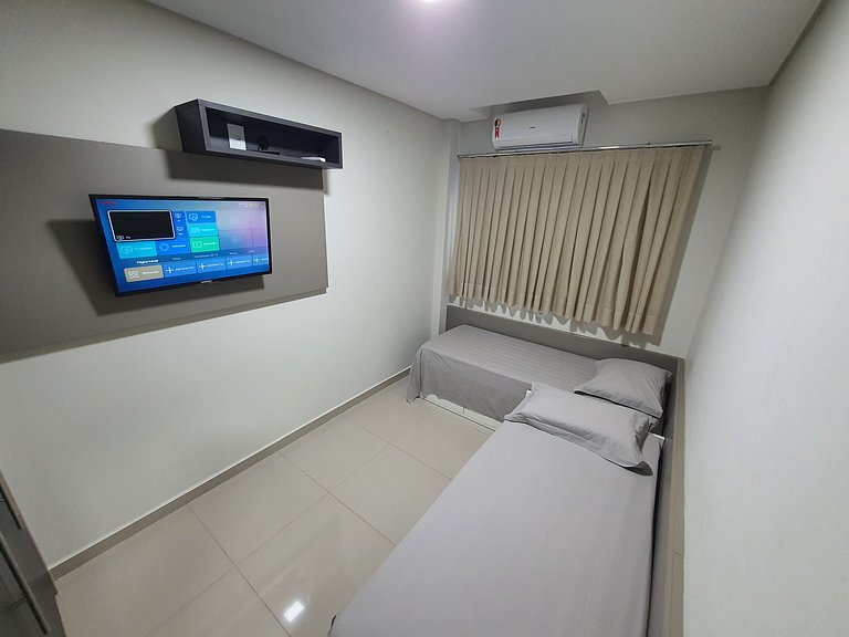 Novo central 2 quartos wifi/garagem/elevador