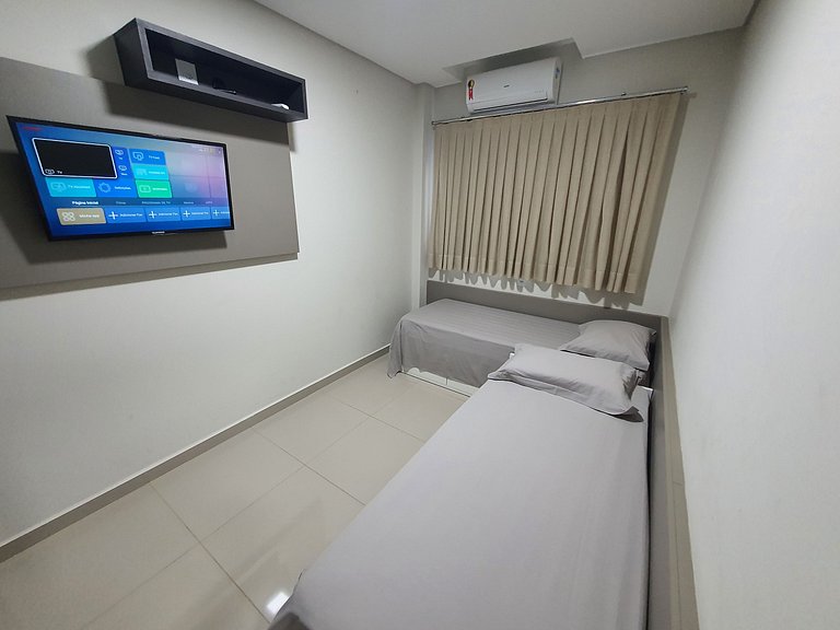 Novo central 2 quartos wifi/garagem/elevador